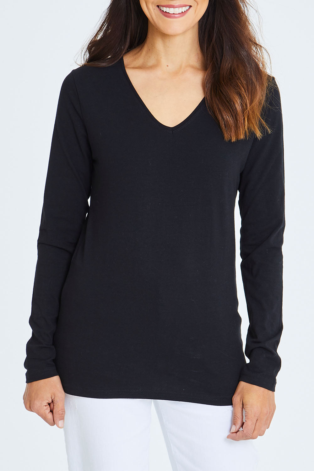Model Cara wearing size 10 of The Long Sleeve V Neck Tee in colour Black (Black), from the front, cropped image