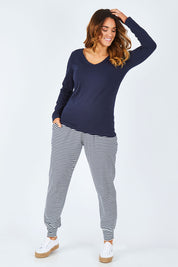 Model Laura wearing size 14 of The Long Sleeve V Neck Tee in colour Navy (Blue), from the front, showing the whole outfit