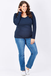 Model Mae wearing size 16 of The Long Sleeve V Neck Tee in colour Navy (Blue), from the front, showing the whole outfit