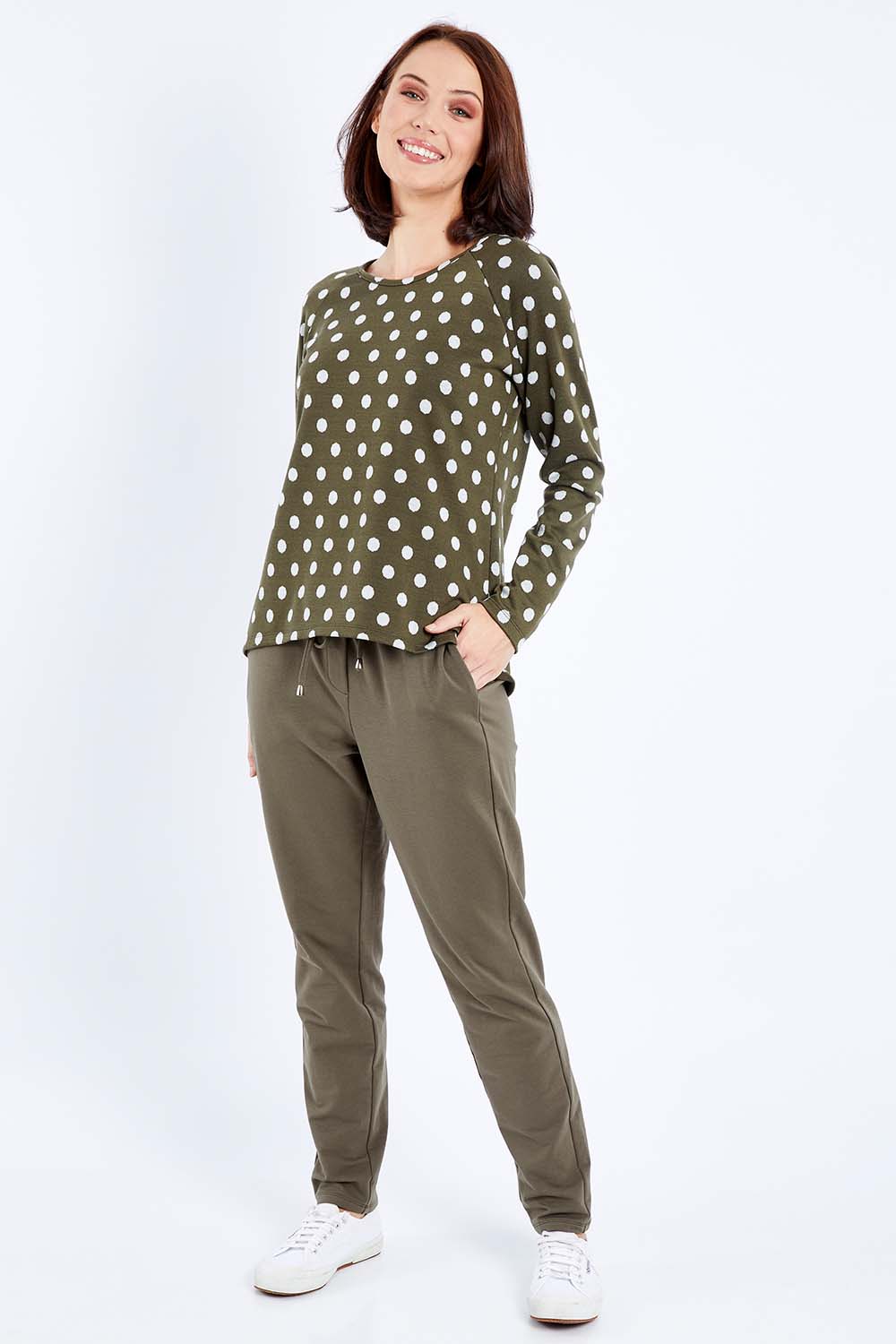 Model Andrea wearing size 10 of The Easy Wear Pull On Pant in colour Khaki (Green), from the front, showing the whole outfit