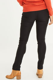 Model Cara wearing size 10 of The Brushed Bengaline Pant in colour Black (Black), from the back