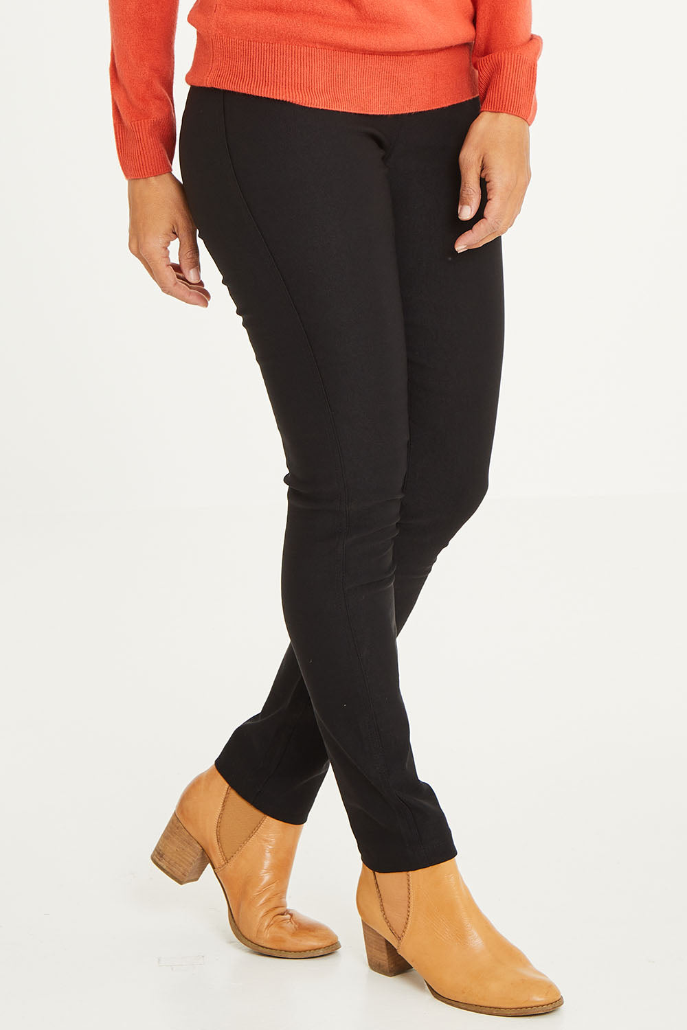 Model Cara wearing size 10 of The Brushed Bengaline Pant in colour Black (Black), from the front, cropped image