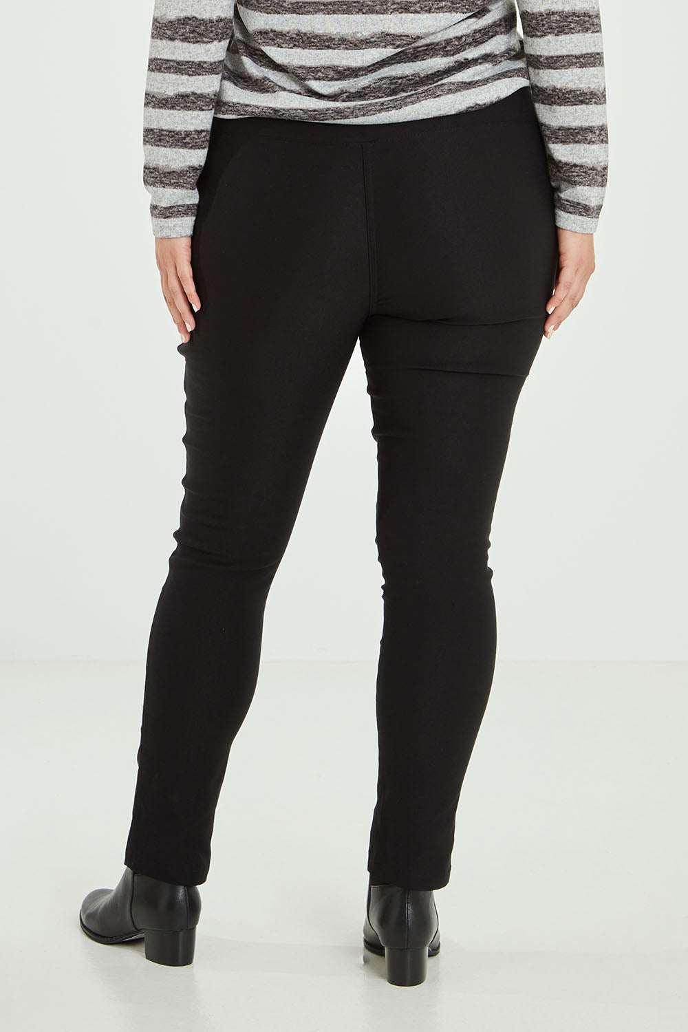 Model Jess wearing size 14 of The Brushed Bengaline Pant in colour Black (Black), from the back