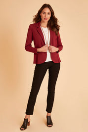Model Madeline wearing size 10 of The Brushed Bengaline Pant in colour Black (Black), from the front, showing the whole outfit