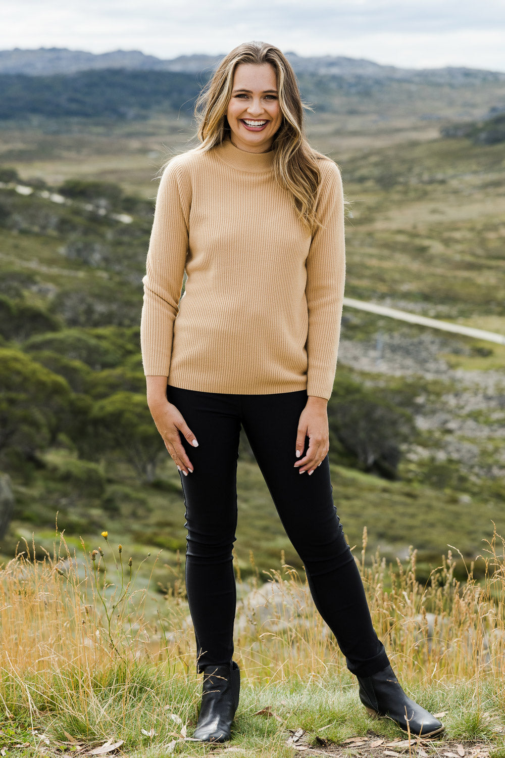 Model Tahlia wearing size 10 of The Brushed Bengaline Pant in colour Black (Black), from the front, showing the whole outfit