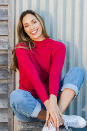 Model Amanda wearing size S of The Essential Soft Jumper in colour Crimson (Red), from the front, showing the whole outfit