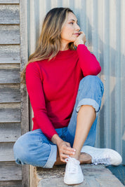 Model Amanda wearing size S of The Essential Soft Jumper in colour Crimson (Red), from the front, showing the whole outfit