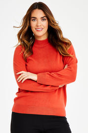 Model Laura wearing size L of The Essential Soft Jumper in colour Ginger, from the front, cropped image