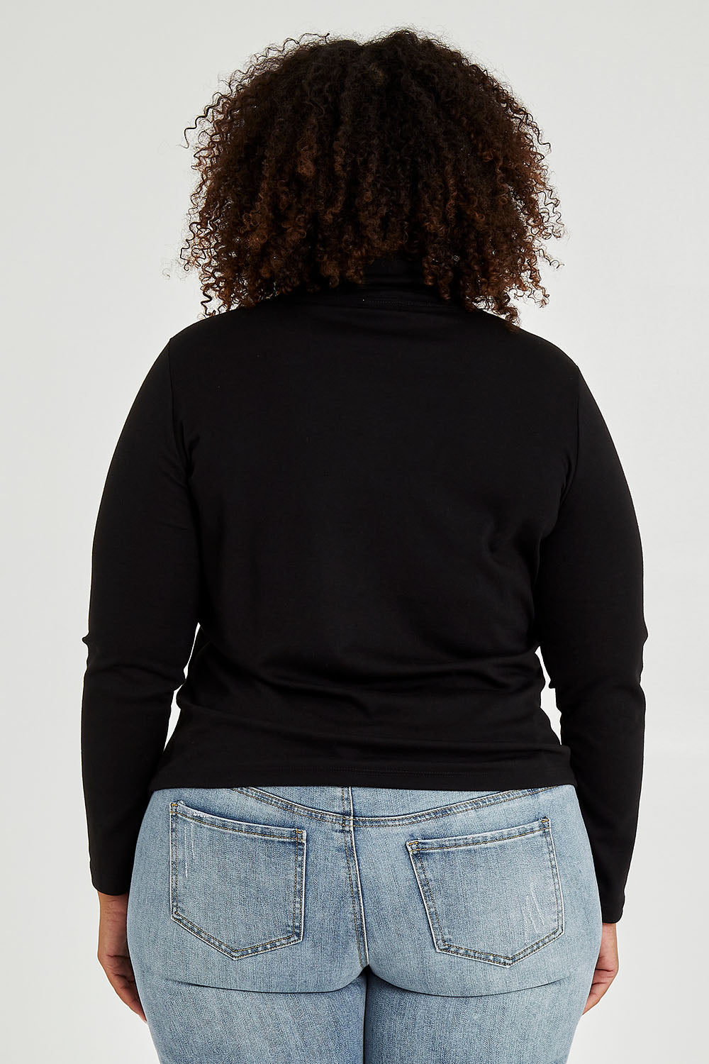 Model Alexis wearing size 16 of The Easy Wear Skivvy in colour Black (Black), from the back