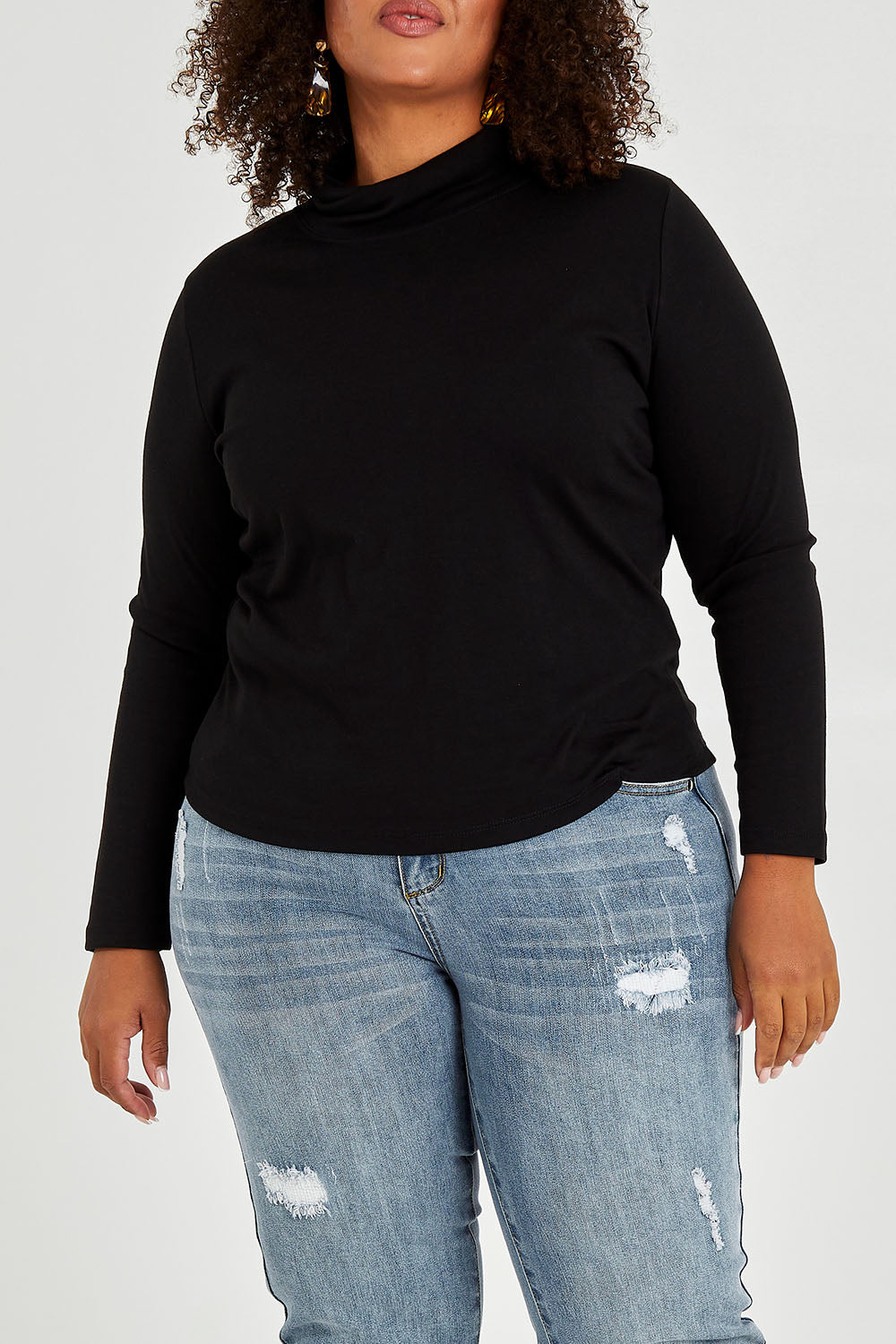 Model Alexis wearing size 16 of The Easy Wear Skivvy in colour Black (Black), from the front, cropped image