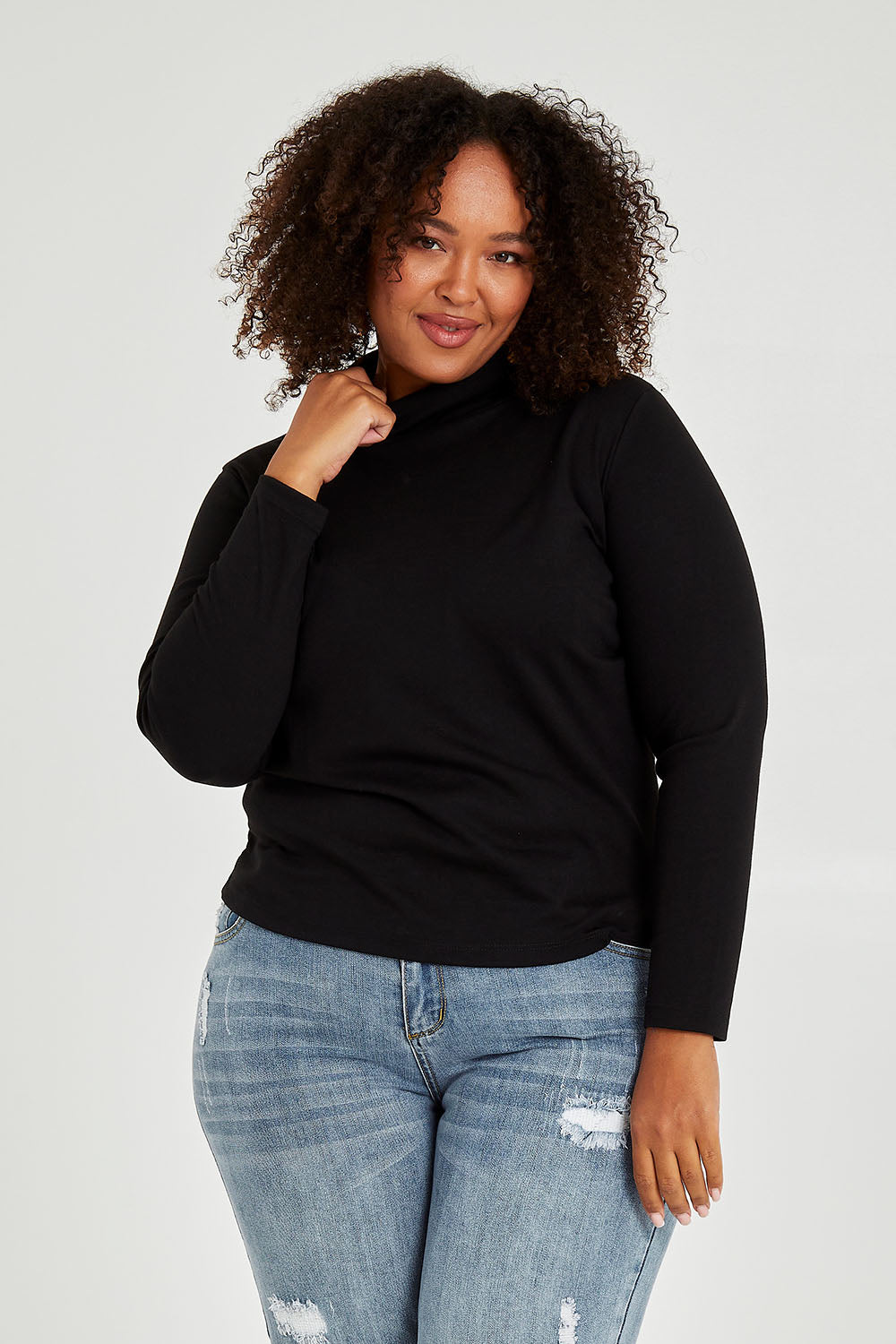 Model Alexis wearing size 16 of The Easy Wear Skivvy in colour Black (Black), from the front, cropped image
