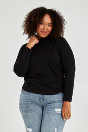 Model Alexis wearing size 16 of The Easy Wear Skivvy in colour Black (Black), from the front, cropped image