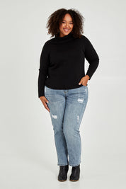 Model Alexis wearing size 16 of The Easy Wear Skivvy in colour Black (Black), from the front, showing the whole outfit