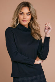 Model Alice wearing size 10 of The Easy Wear Skivvy in colour Black (Black), from the front, showing the whole outfit