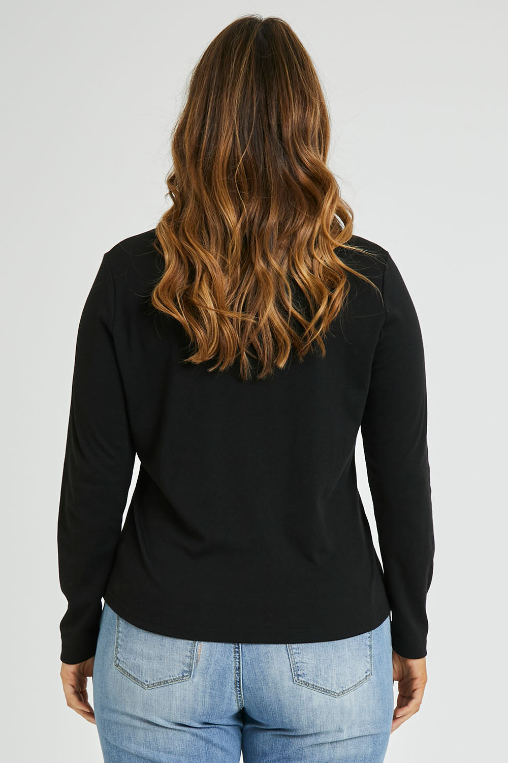 Model Laura wearing size 14 of The Easy Wear Skivvy in colour Black (Black), from the back