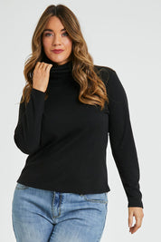 Model Laura wearing size 14 of The Easy Wear Skivvy in colour Black (Black), from the front, cropped image