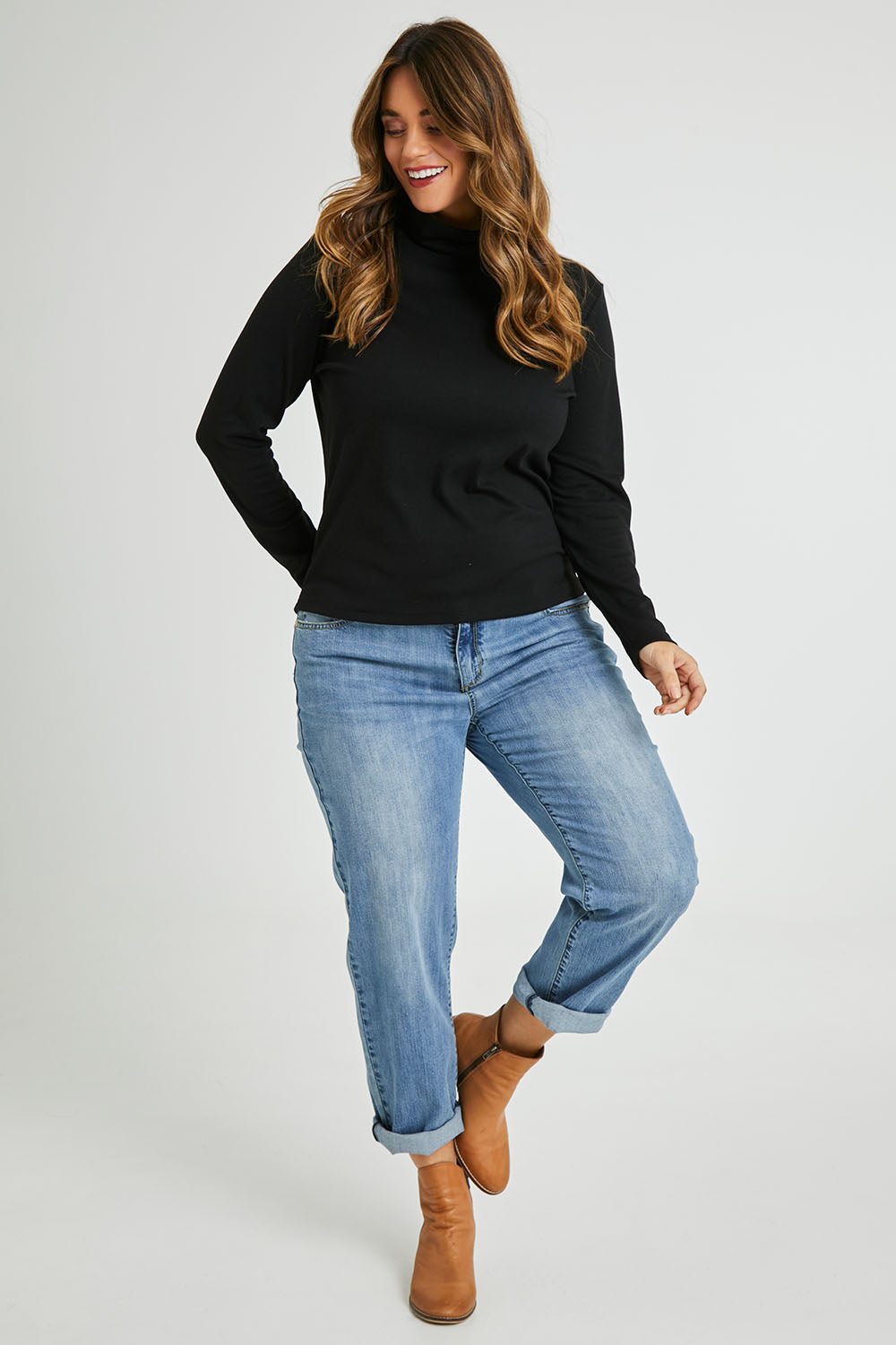 Model Laura wearing size 14 of The Easy Wear Skivvy in colour Black (Black), from the front, showing the whole outfit