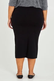 Model Alexis wearing size 16 of The Ponte Pull On Midi Skirt in colour Black (Black), from the back
