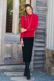 Model Amanda wearing size 10 of The Ponte Pull On Midi Skirt in colour Black (Black), from the front, showing the whole outfit