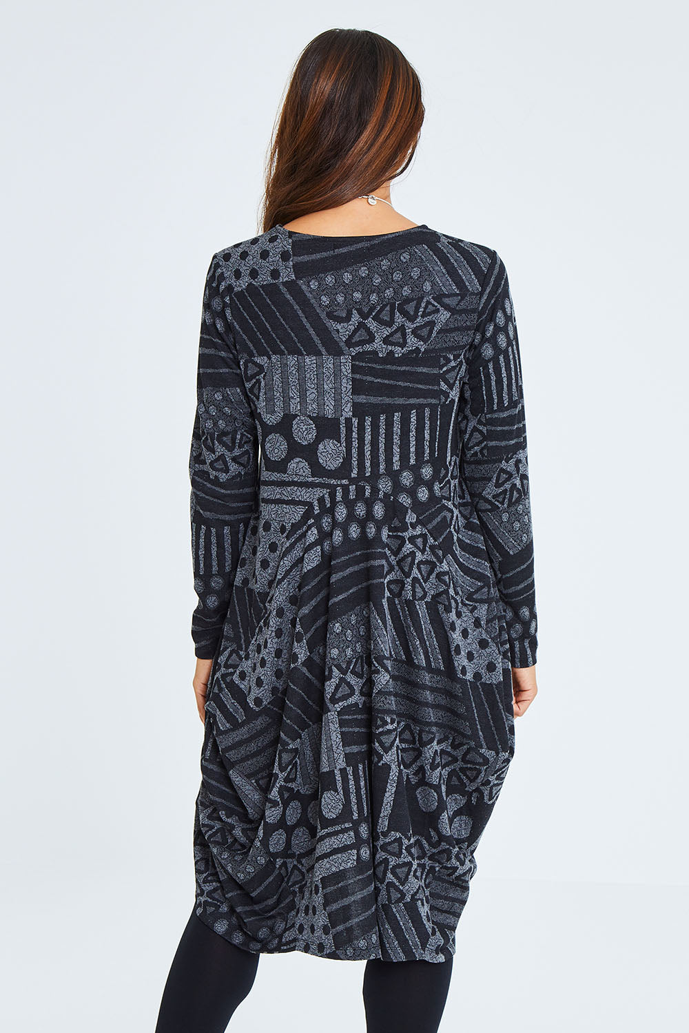 Model Cara wearing size 10 of The Jacquard Bounce Dress in colour Charcoal (Grey), from the back