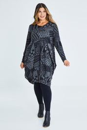 Model Palatina wearing size 16 of The Jacquard Bounce Dress in colour Charcoal (Grey), from the front, showing the whole outfit