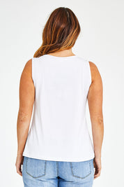 Model Laura wearing size 14 of The Classic Tank in colour Vanilla (White), from the back