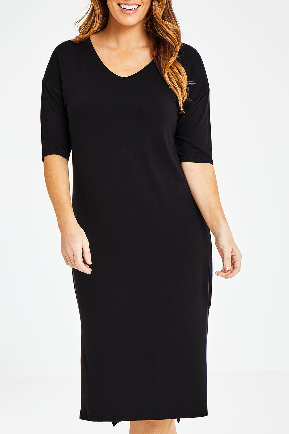 Model Laura wearing size 14 of The 3/4 Sleeve Mid Length Tee Dress in colour Black (Black), from the front, cropped image