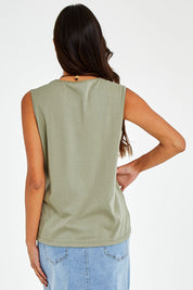 Model Vitoria wearing size 10 of The Essential Crew Neck Tank in colour Olive (Green), from the back