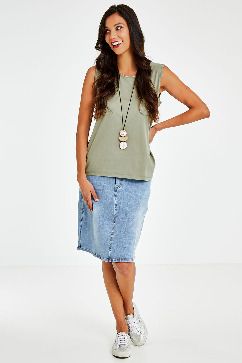 Model Vitoria wearing size 10 of The Essential Crew Neck Tank in colour Olive (Green), from the front, showing the whole outfit