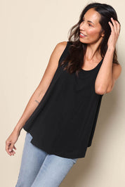 Model Amandam wearing size 10 of the The Essential Swing Tank – Black in colour Black, from an angle