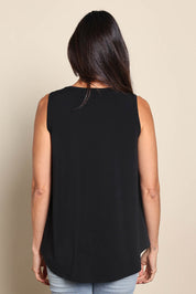 Model Amandam wearing size 10 of the The Essential Swing Tank – Black in colour Black, from the back