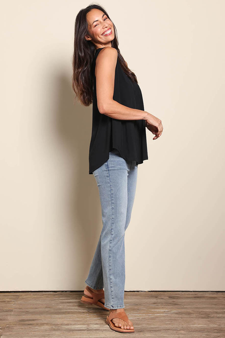 Model Amandam wearing size 10 of the The Essential Swing Tank – Black in colour Black, from the front