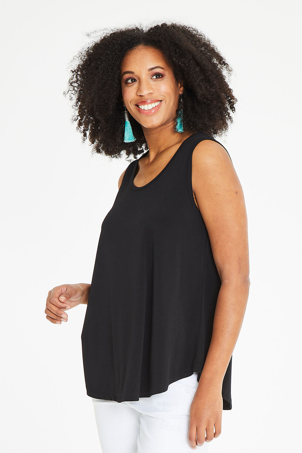 Model Schanez wearing size 10 of The Essential Swing Tank in colour Black (Black), from the front, cropped image