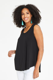 Model Schanez wearing size 10 of The Essential Swing Tank in colour Black (Black), from the front, cropped image