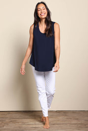 Model Amandam wearing size 10 of the The Essential Swing Tank – Navy in colour Navy, from the front
