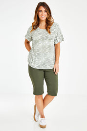 Model Laura wearing size 14 of The Frill Sleeve Blouse in colour Khaki (Green), from the front, showing the whole outfit