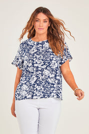 Model Laura wearing size 14 of The Frill Sleeve Blouse in colour Navywhite (Blue), from the front, cropped image