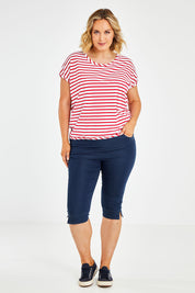 Model Jess wearing size 14 of The 3/4 Pull On Jean in colour Denim (Blue), from the front, showing the whole outfit
