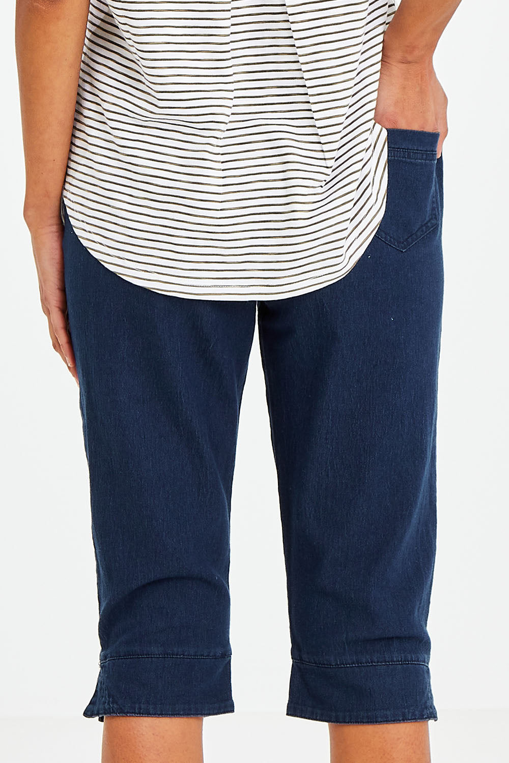Model Vitoria wearing size 10 of The 3/4 Pull On Jean in colour Denim (Blue), from the back