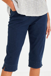 Model Vitoria wearing size 10 of The 3/4 Pull On Jean in colour Denim (Blue), from the front, cropped image