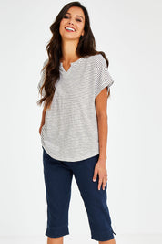 Model Vitoria wearing size 10 of The 3/4 Pull On Jean in colour Denim (Blue), from the front, cropped image