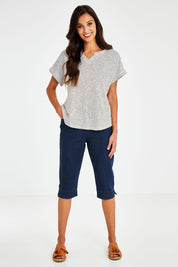 Model Vitoria wearing size 10 of The 3/4 Pull On Jean in colour Denim (Blue), from the front, showing the whole outfit