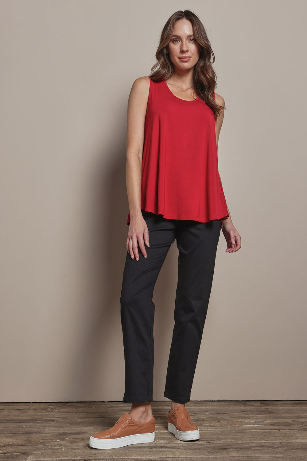 Model Madeline wearing size 10 of The 7/8 Pull On Pant in colour Black (Black), from the front, showing the whole outfit