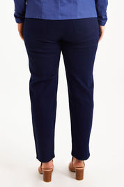 Model Monique wearing size 14 of The 7/8 Pull On Pant in colour Darkdenim (Blue), from the back