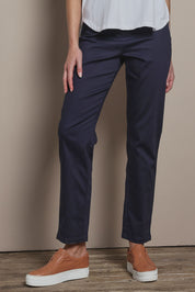 Model Madeline wearing size 10 of The 7/8 Pull On Pant in colour Darknavy (Blue), from the front, cropped image