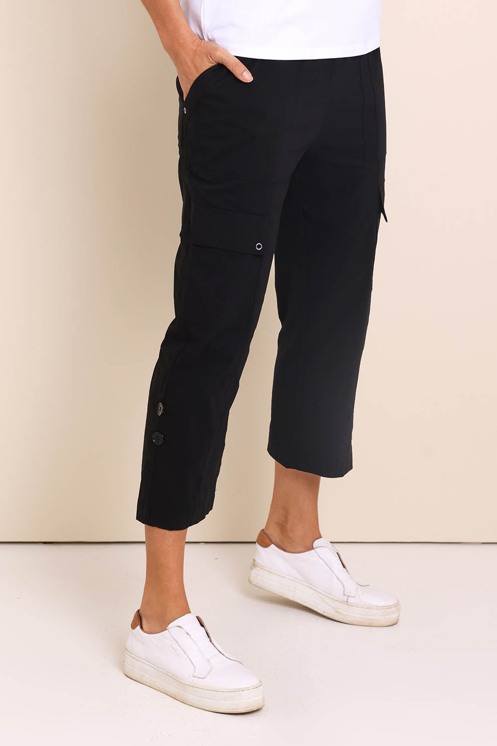 Model Amandam wearing size 10 of the The Cotton Blend Cargo Pant - Black in colour Black, from an angle