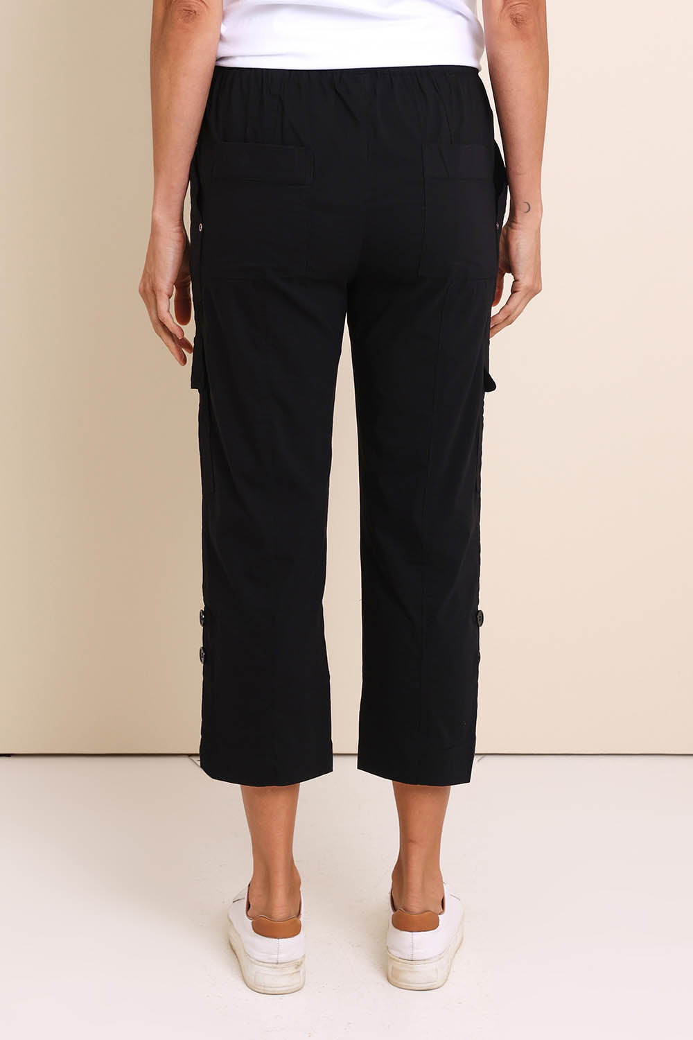Model Amandam wearing size 10 of the The Cotton Blend Cargo Pant - Black in colour Black, from the back