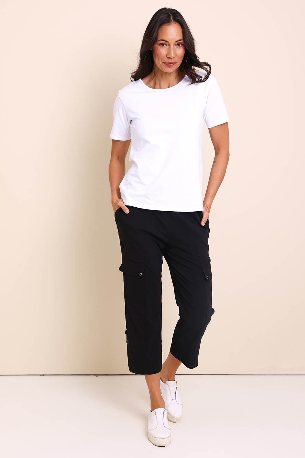 Model Amandam wearing size 10 of the The Cotton Blend Cargo Pant - Black in colour Black, from the front