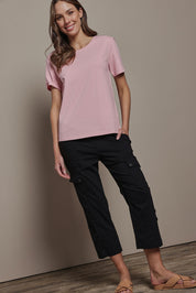 Model Madeline wearing size 10 of The Cotton Blend Cargo Pant in colour Black (Black), from the front, showing the whole outfit