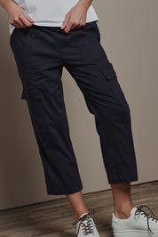 Model Madeline wearing size 10 of The Cotton Blend Cargo Pant in colour Navy (Blue), from the front, cropped image